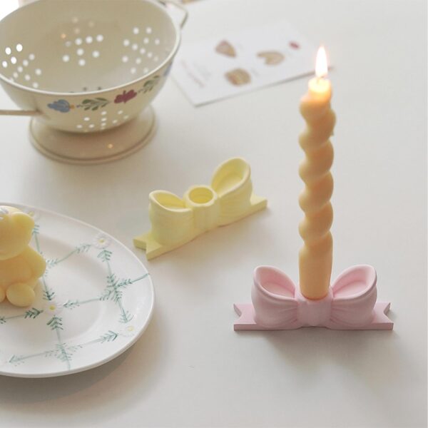 write a description of Bow candle holder Bow candlestick holder