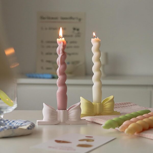 write a description of Bow candle holder Bow candlestick holder