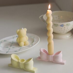 write a description of Bow candle holder Bow candlestick holder