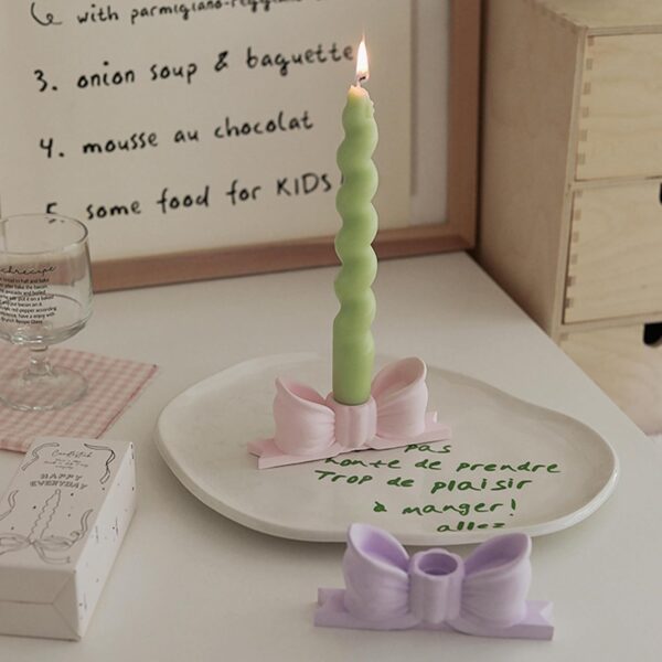 write a description of Bow candle holder Bow candlestick holder