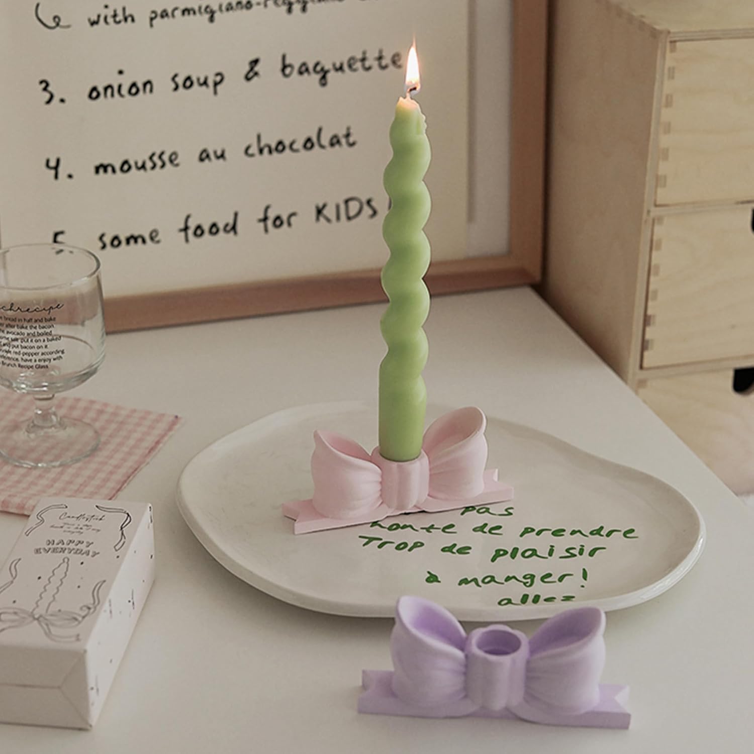 write a description of Bow candle holder Bow candlestick holder
